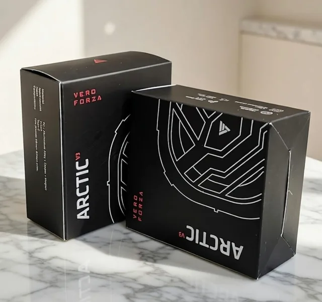 Black Arctic cartons with white line graphics on marble