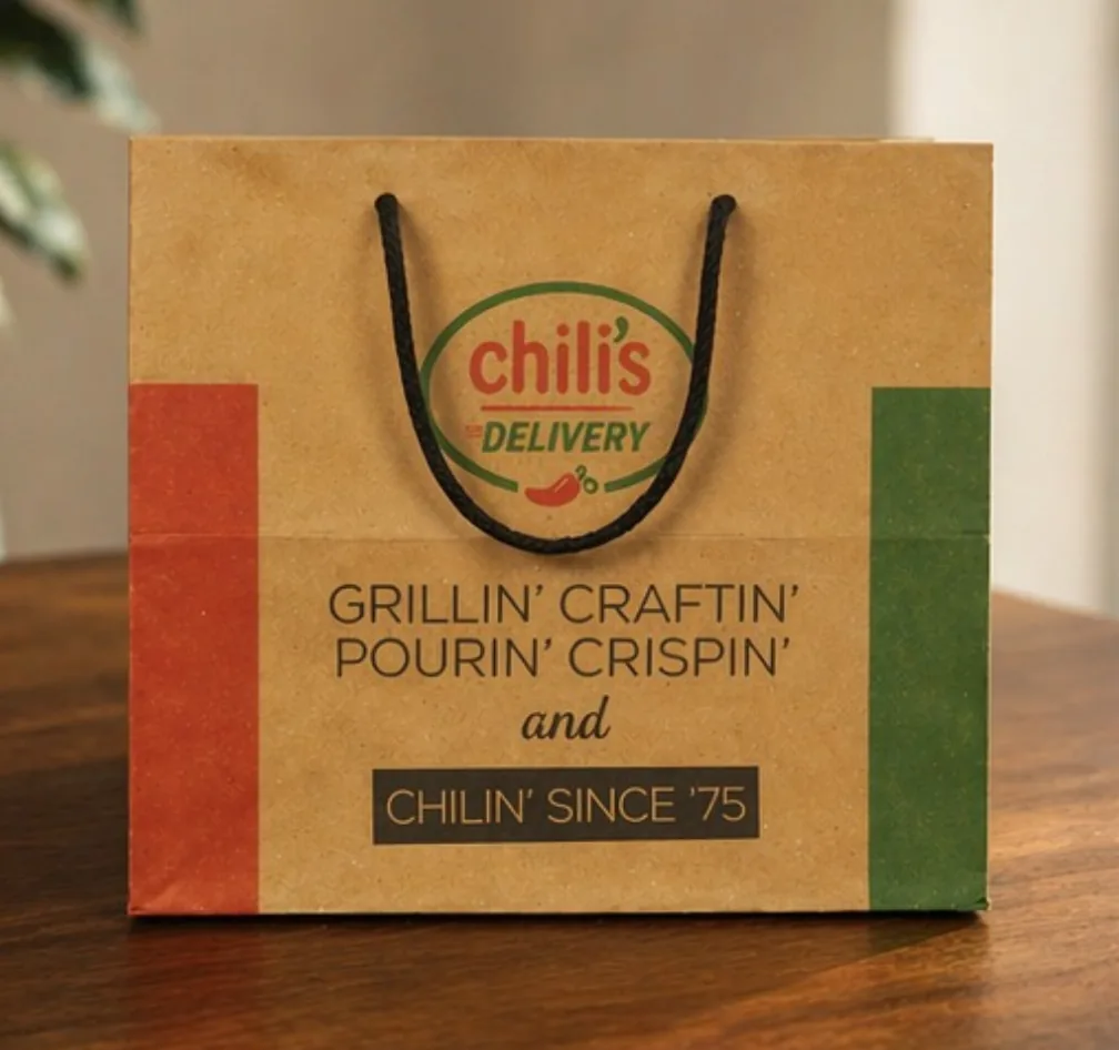 Kraft paper delivery bag printed in red and green with rope handles