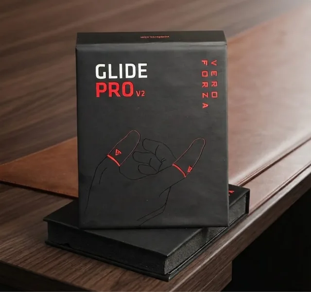 Matte black Glide Pro rigid box on a walnut desk