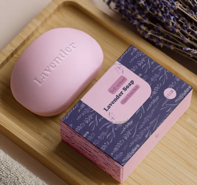 Pink and lavender offset-printed soap carton beside a bar of soap