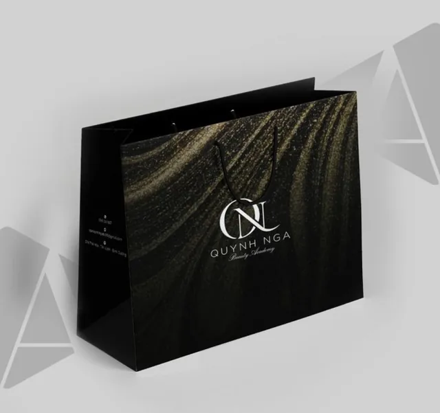 Black bag with gold shimmer pattern and a monogram