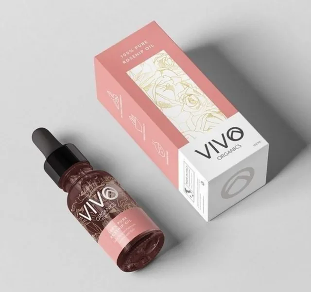 White and pink rosehip oil carton with dropper bottle